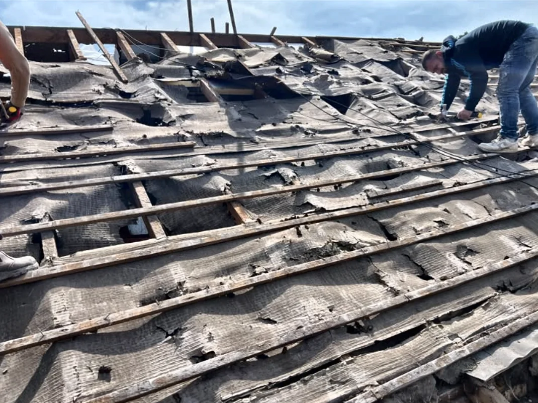Cardiff roof stripped back to the rafters revealing perished felt and old battens